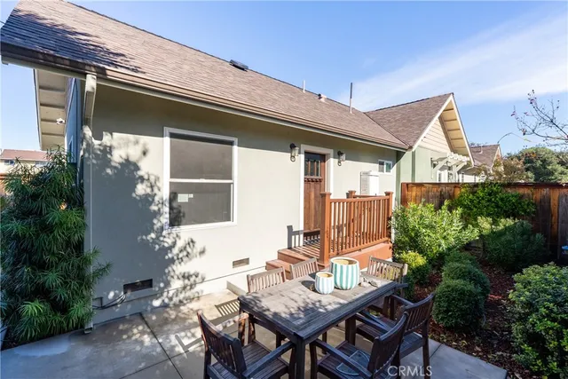 a view of bathroom with a toilet mirror shower vanity and a sink