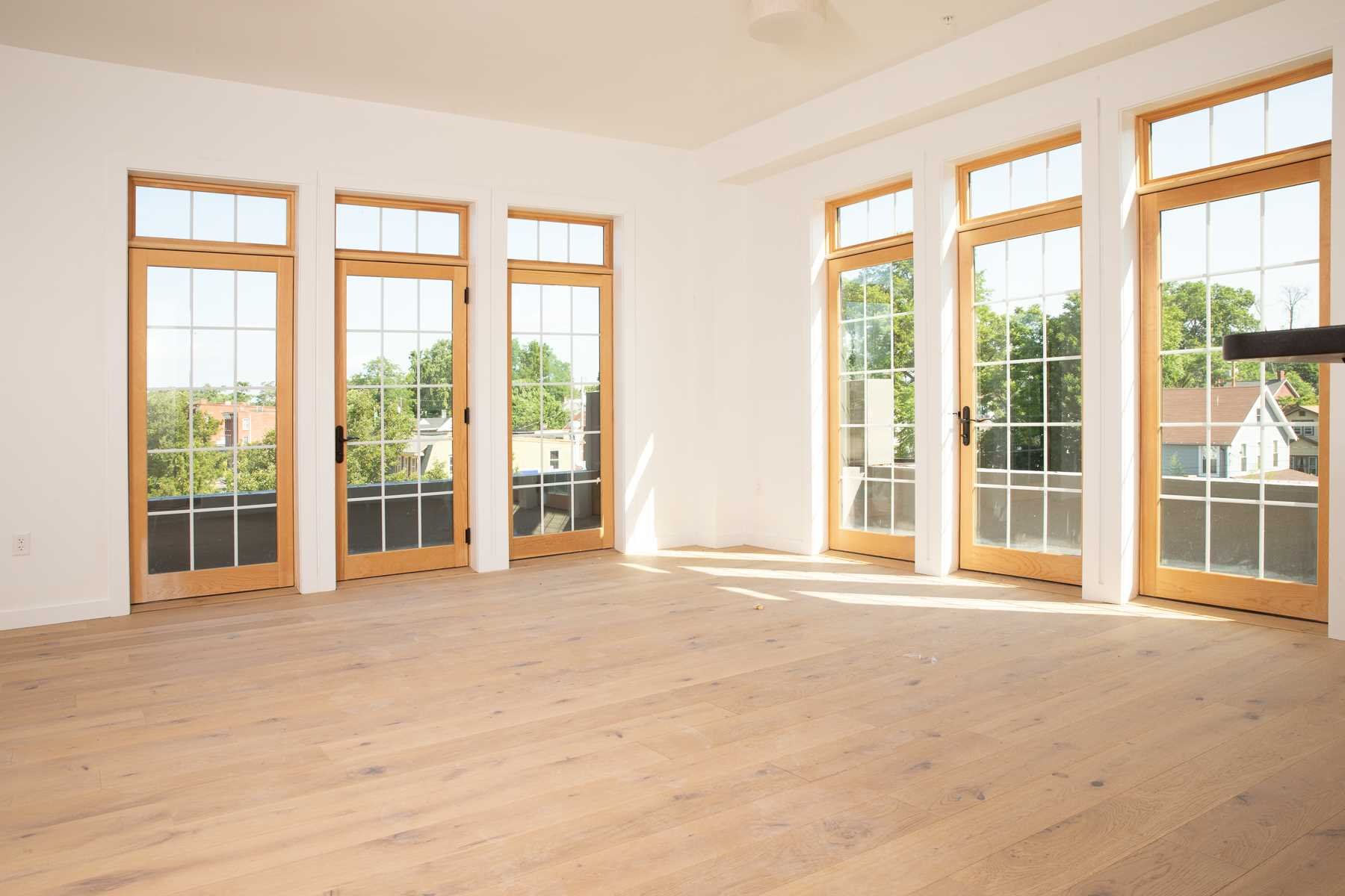 a view of an empty room with a large windows