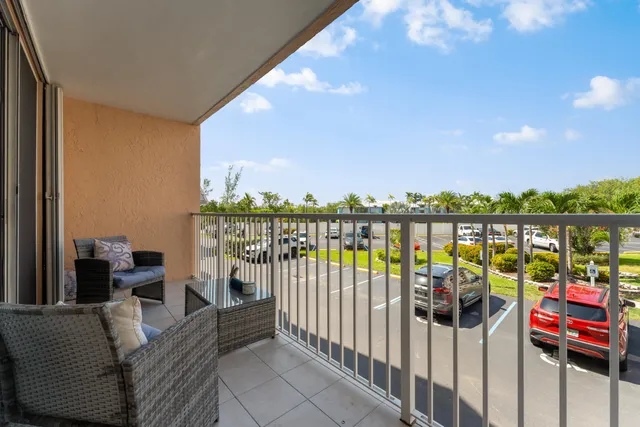 a balcony with furniture and city view