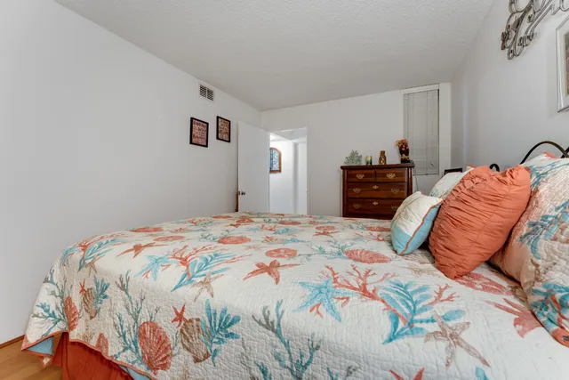 a bedroom with a bed and a closet