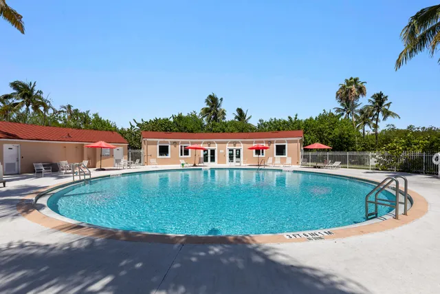 a view of a swimming pool with a yard