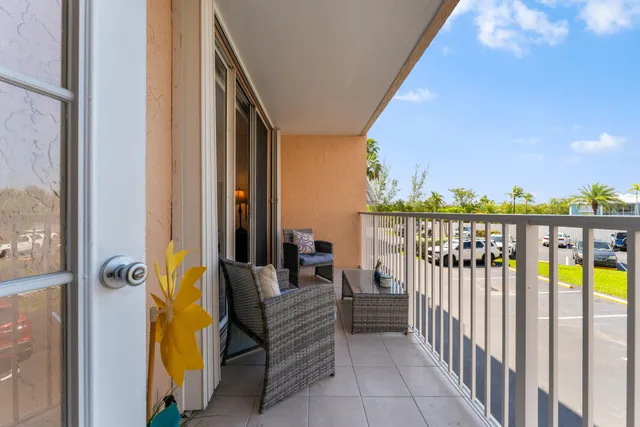 a view of a balcony with furniture