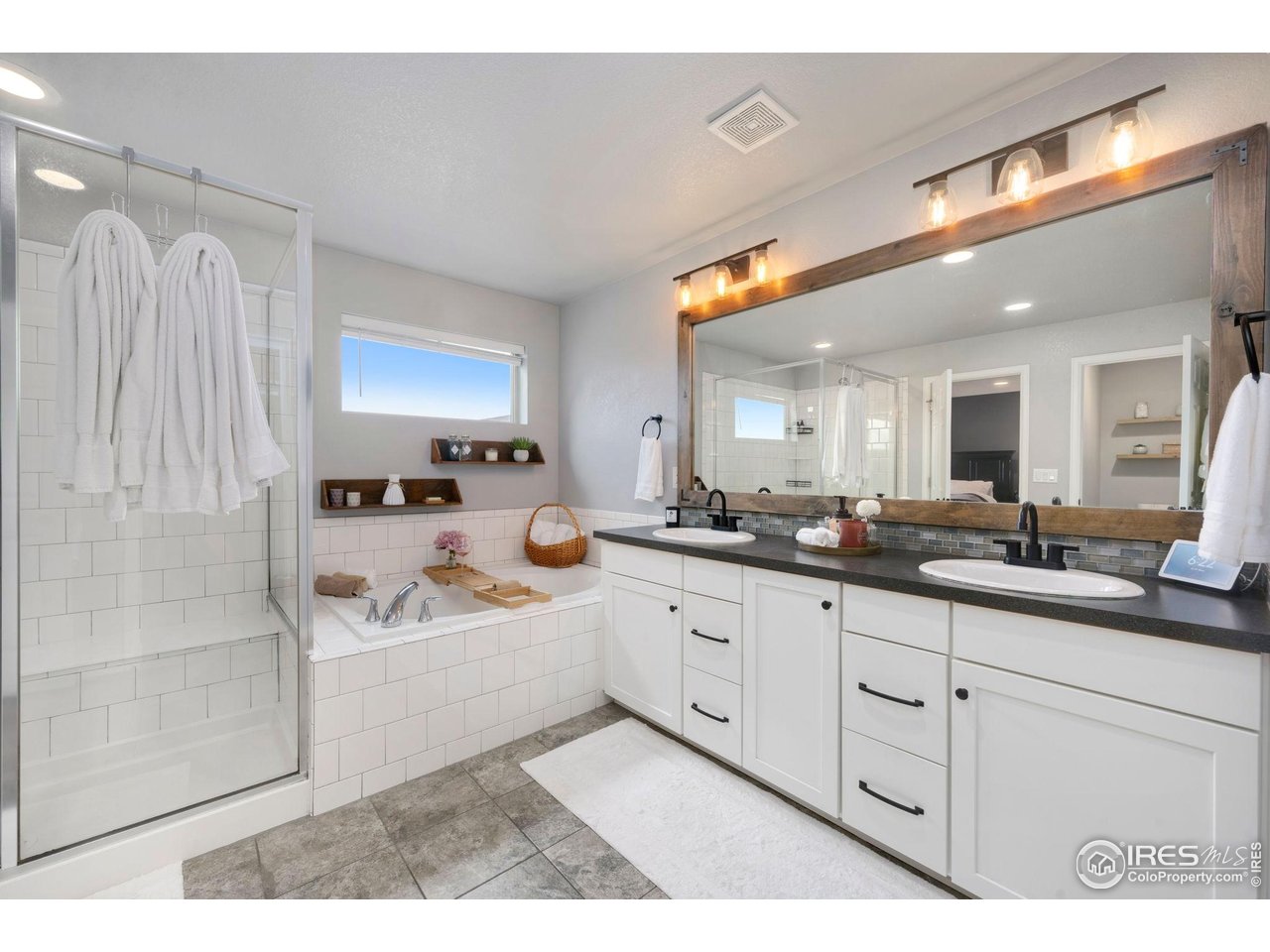6420 Tuxedo Park Road Timnath, CO 80547 - Photo 16 of 44 a kitchen with sink and mirror