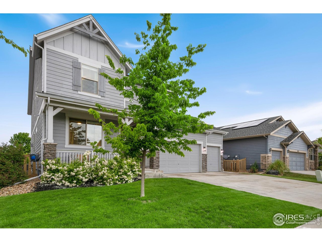 6420 Tuxedo Park Road Timnath, CO 80547 - Photo 2 of 44 a front view of house with a garden