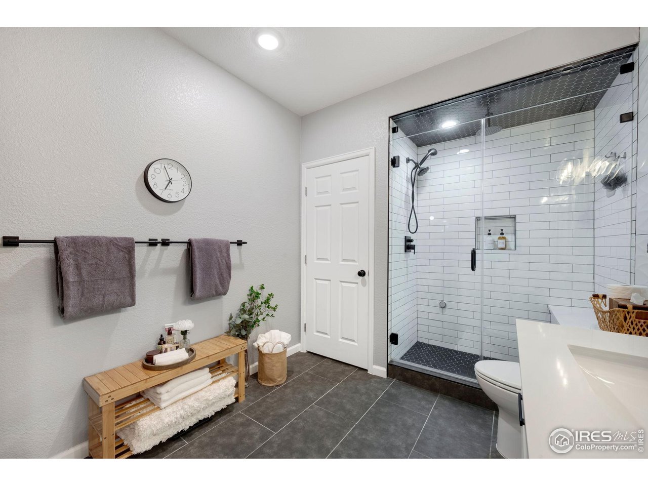 6420 Tuxedo Park Road Timnath, CO 80547 - Photo 23 of 44 a bathroom with a tub sink and mirror