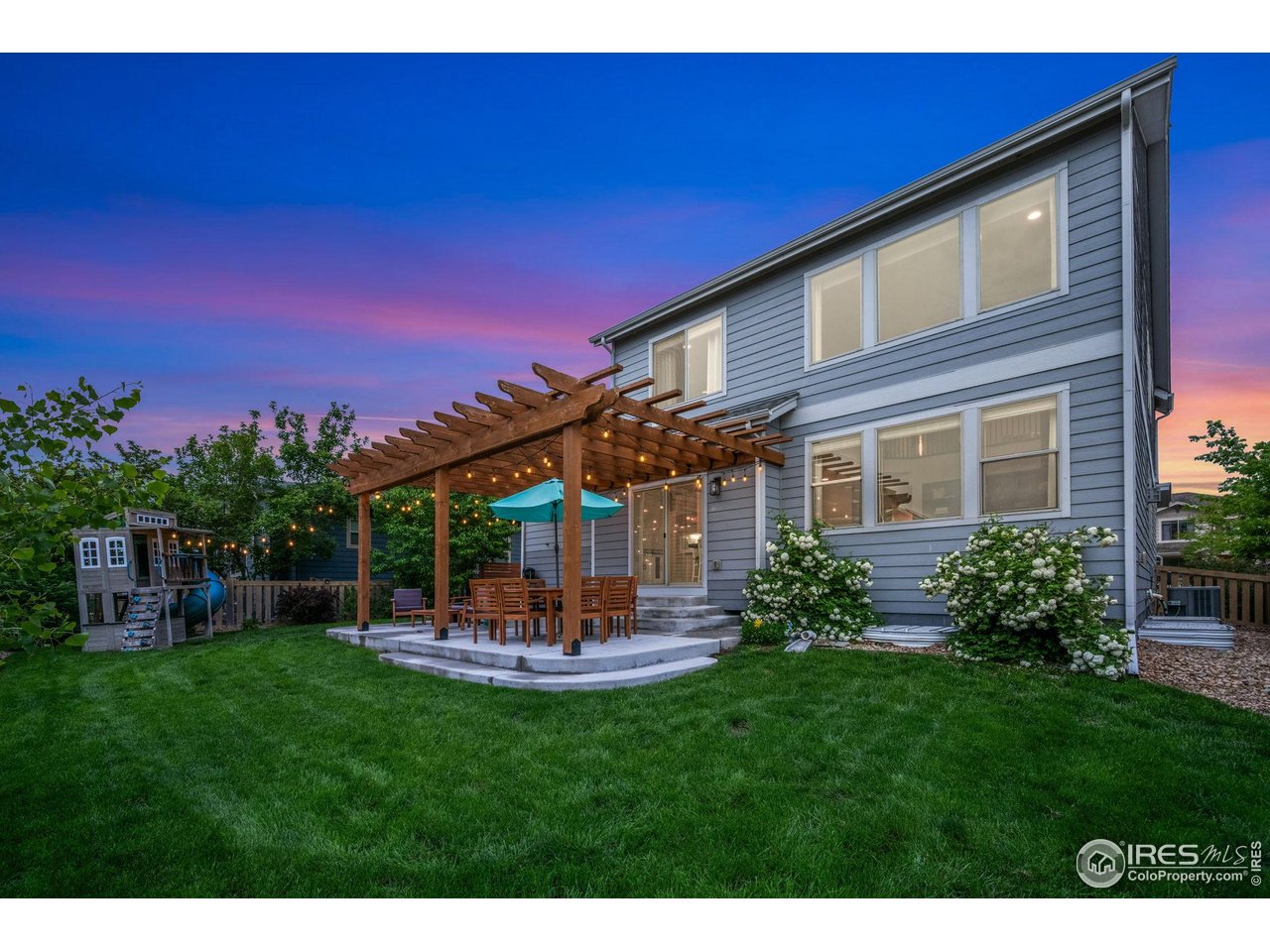 6420 Tuxedo Park Road Timnath, CO 80547 - Photo 27 of 44 a view of a house with a backyard porch and sitting area
