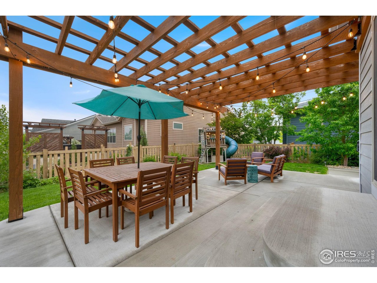 6420 Tuxedo Park Road Timnath, CO 80547 - Photo 29 of 44 a patio with a table and chairs