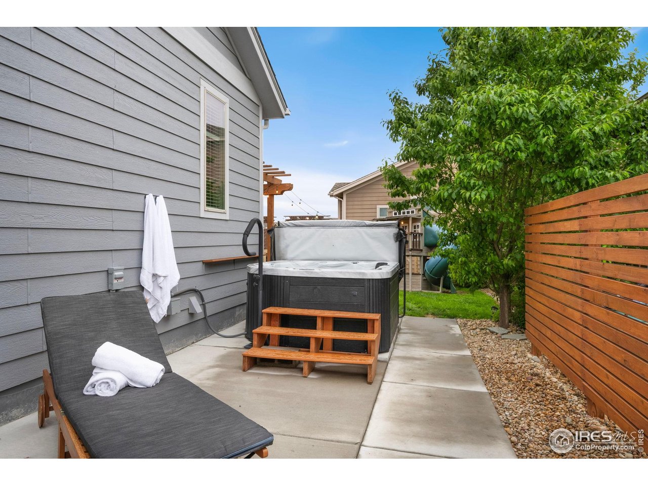 6420 Tuxedo Park Road Timnath, CO 80547 - Photo 32 of 44 a view of backyard with deck and outdoor seating