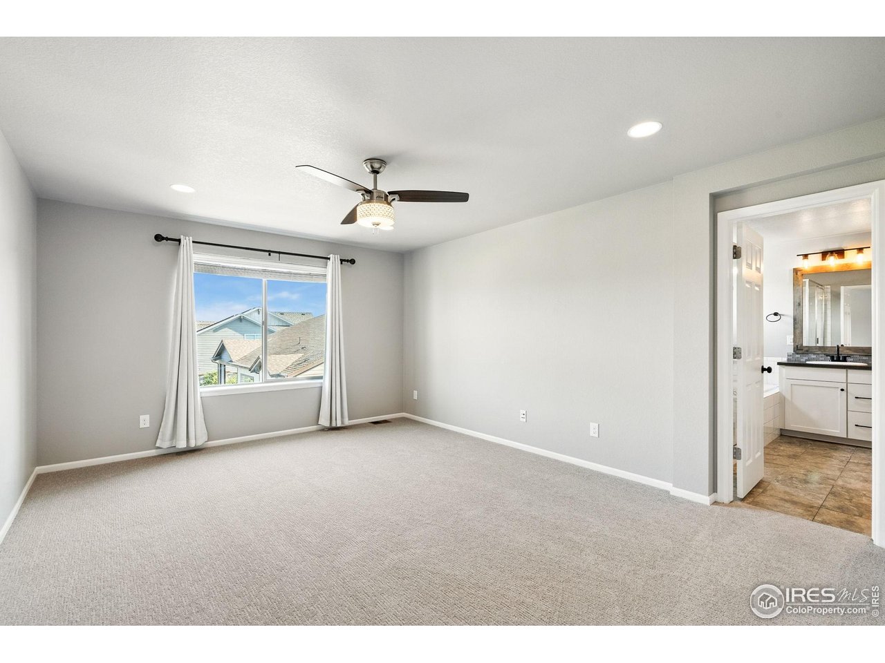 6420 Tuxedo Park Road Timnath, CO 80547 - Photo 38 of 44 a view of an empty room with a window