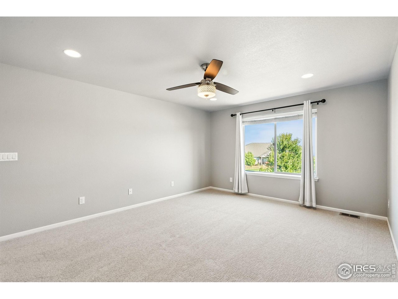 6420 Tuxedo Park Road Timnath, CO 80547 - Photo 39 of 44 a view of an empty room with a window