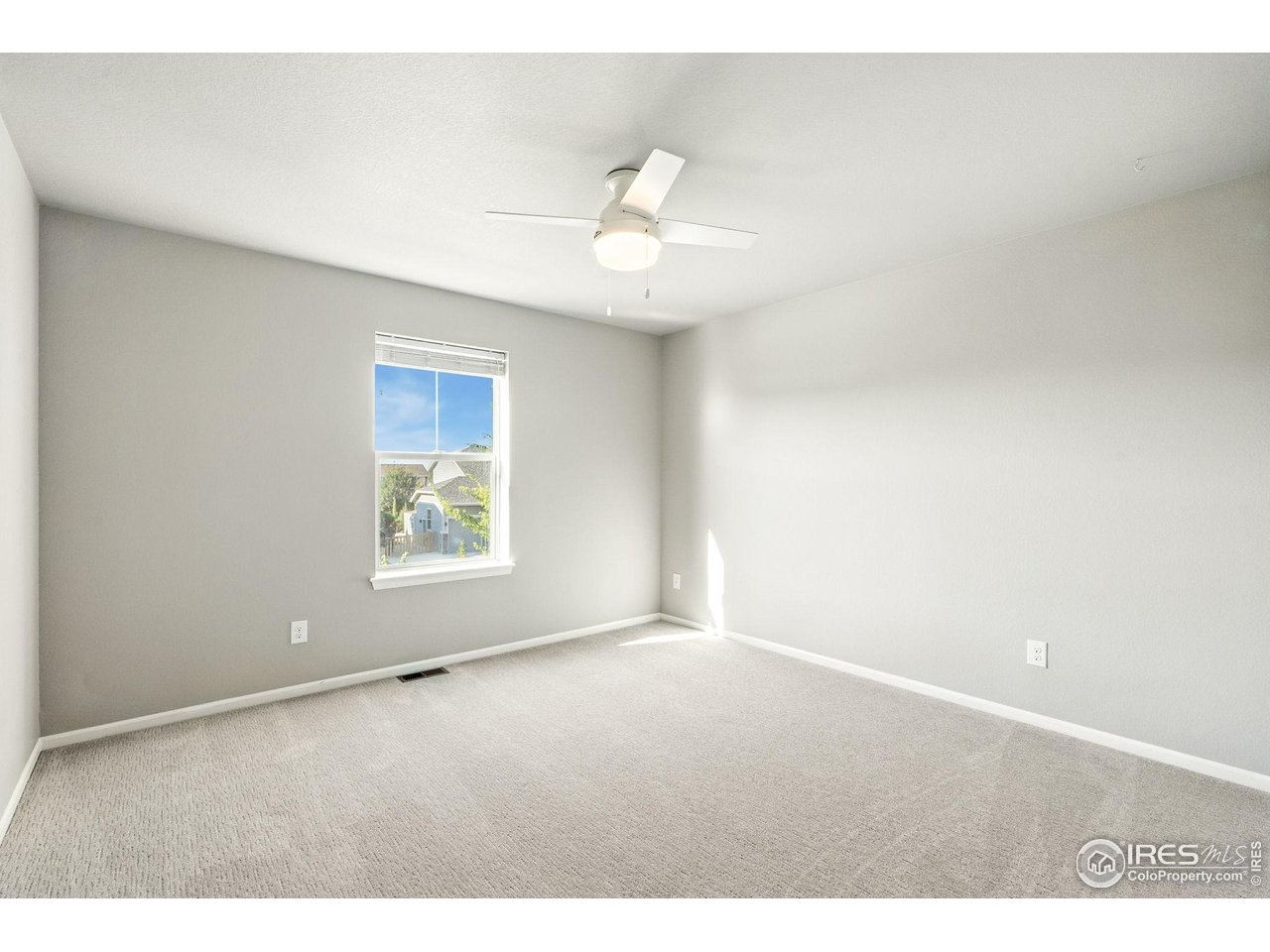 6420 Tuxedo Park Road Timnath, CO 80547 - Photo 40 of 44 a view of an empty room with a window