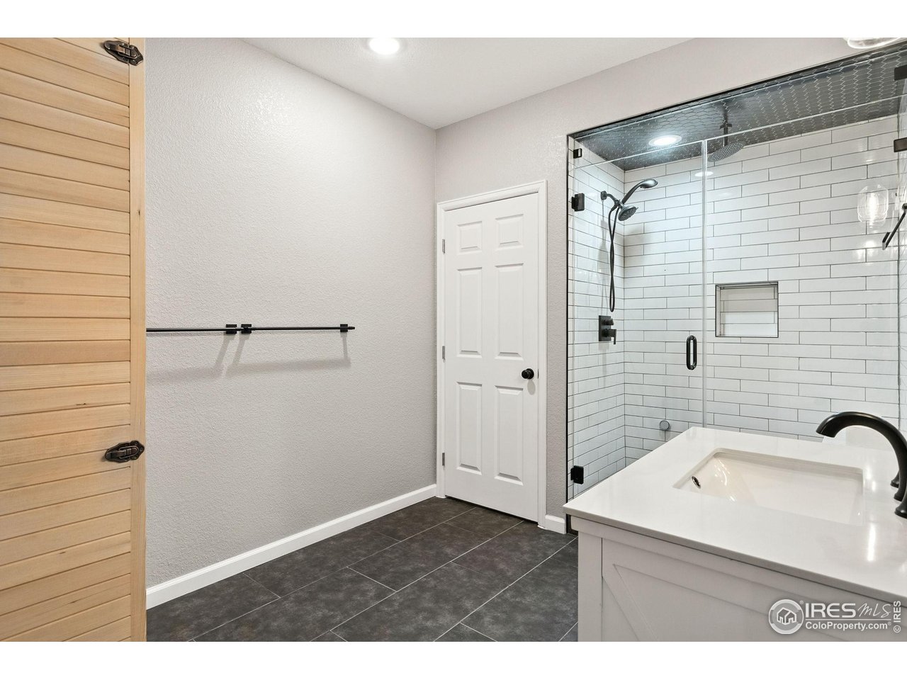 6420 Tuxedo Park Road Timnath, CO 80547 - Photo 43 of 44 a bathroom with a sink and shower