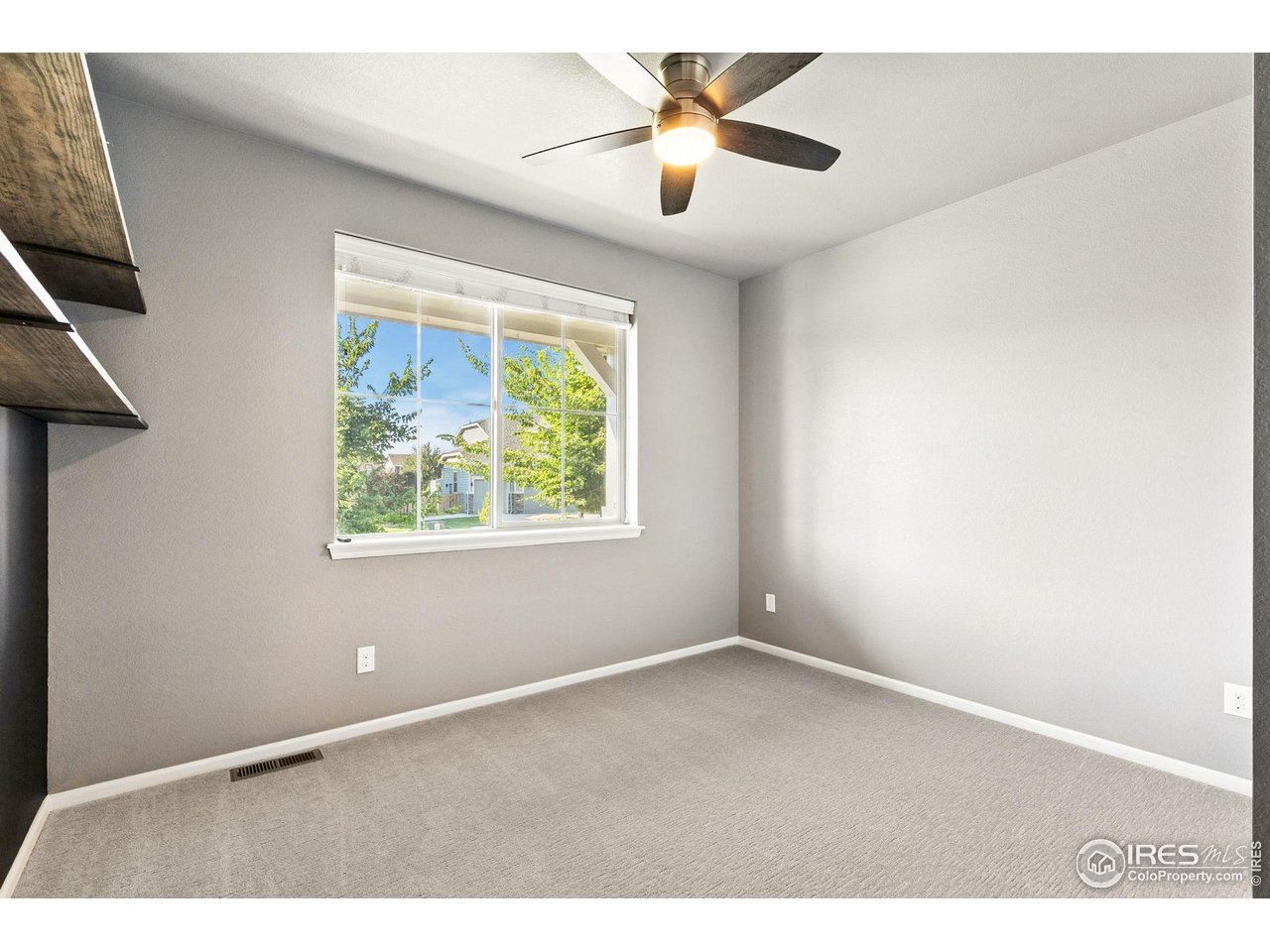 6420 Tuxedo Park Road Timnath, CO 80547 - Photo 44 of 44 a view of an empty room with a window