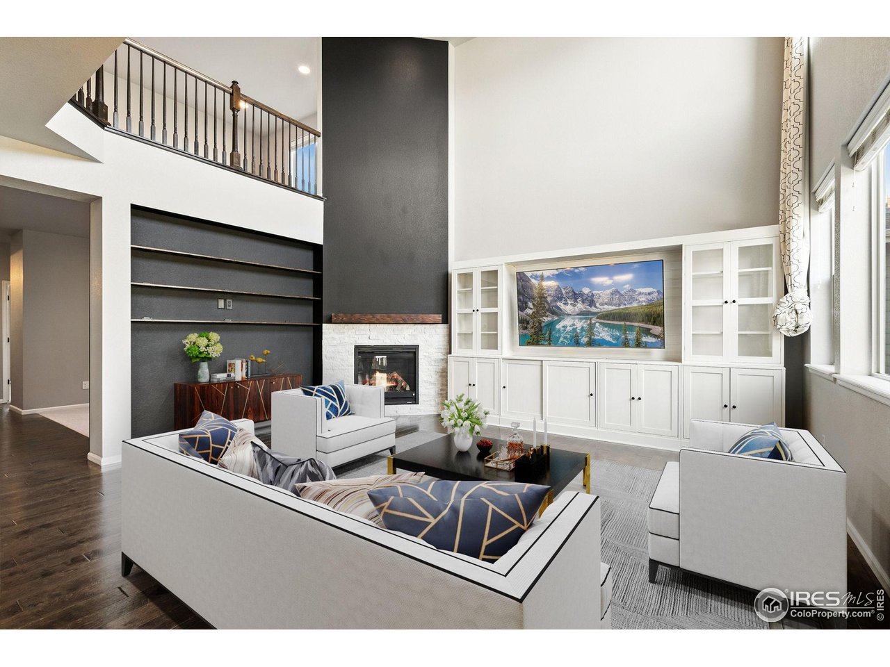 6420 Tuxedo Park Road Timnath, CO 80547 - Photo 7 of 44 a living room with furniture and a flat screen tv