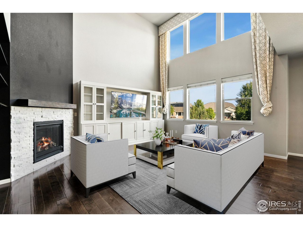 6420 Tuxedo Park Road Timnath, CO 80547 - Photo 8 of 44 a living room with furniture and a fireplace