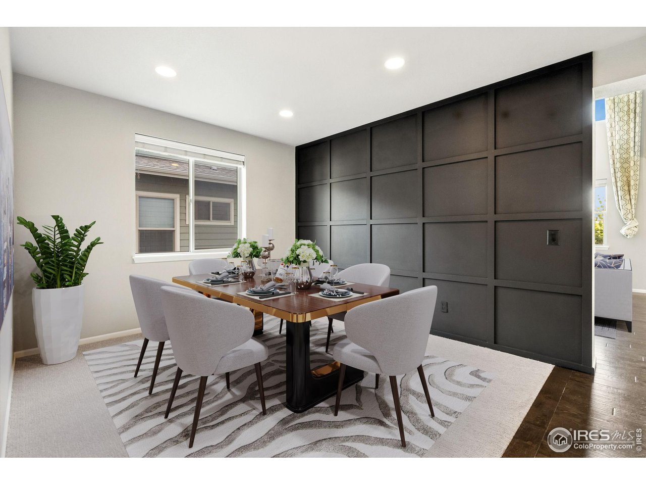 6420 Tuxedo Park Road Timnath, CO 80547 - Photo 9 of 44 a view of a dining room with furniture and wooden floor