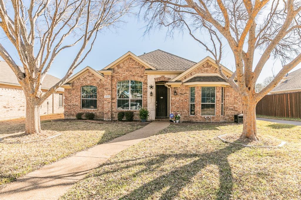 12608 Red Hawk Drive Frisco, TX 75033 - Photo 1 of 1 View of front of house featuring a front lawn, fence, brick siding, and a shingled roof