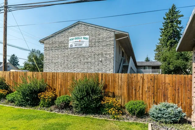 a brick building with a yard