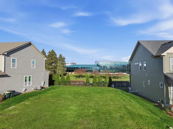 a view of house with backyard