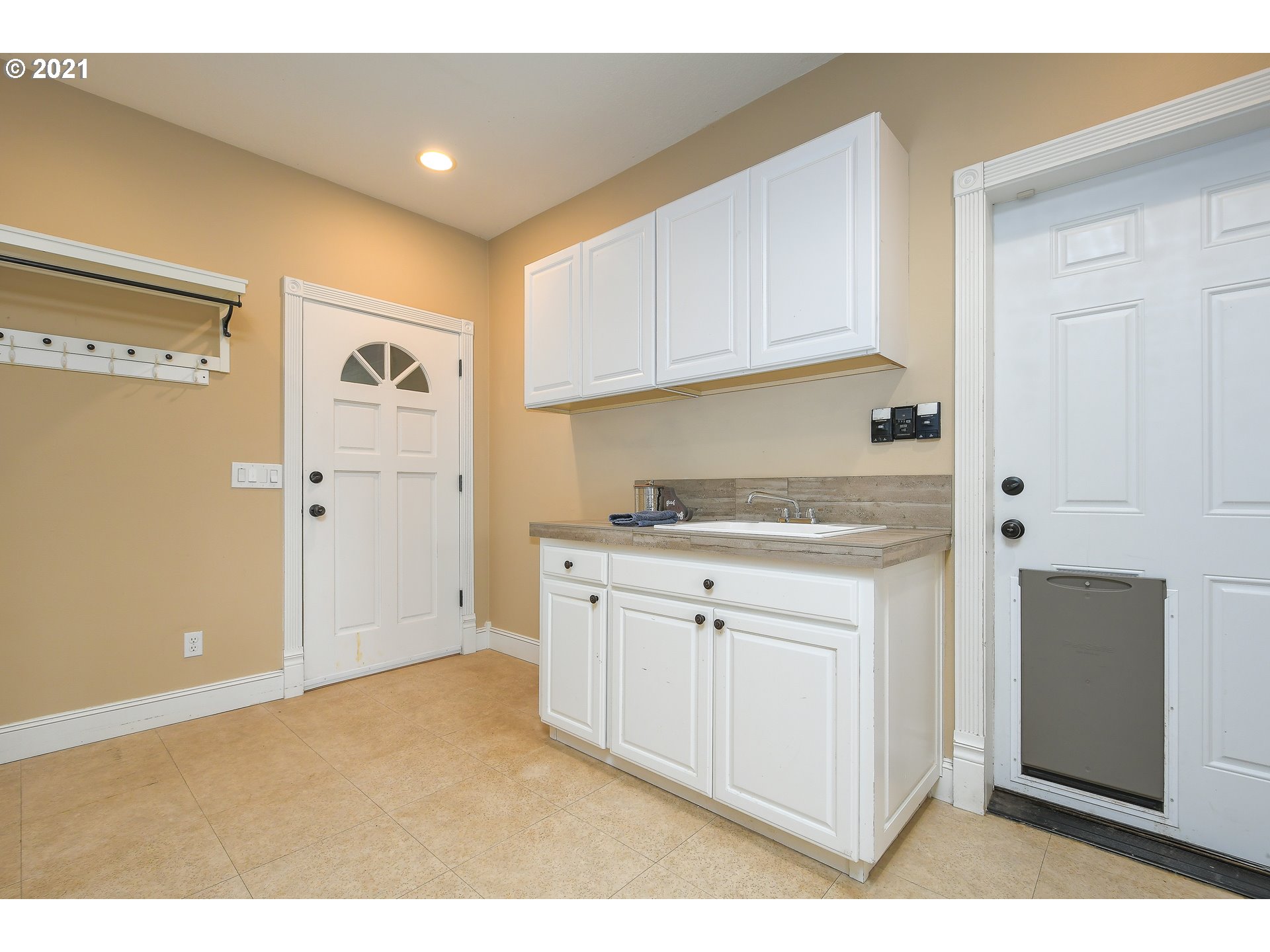 28400 Northeast Hancock Road Camas, WA 98607 - Photo 16 of 32 a kitchen with cabinets appliances and a window