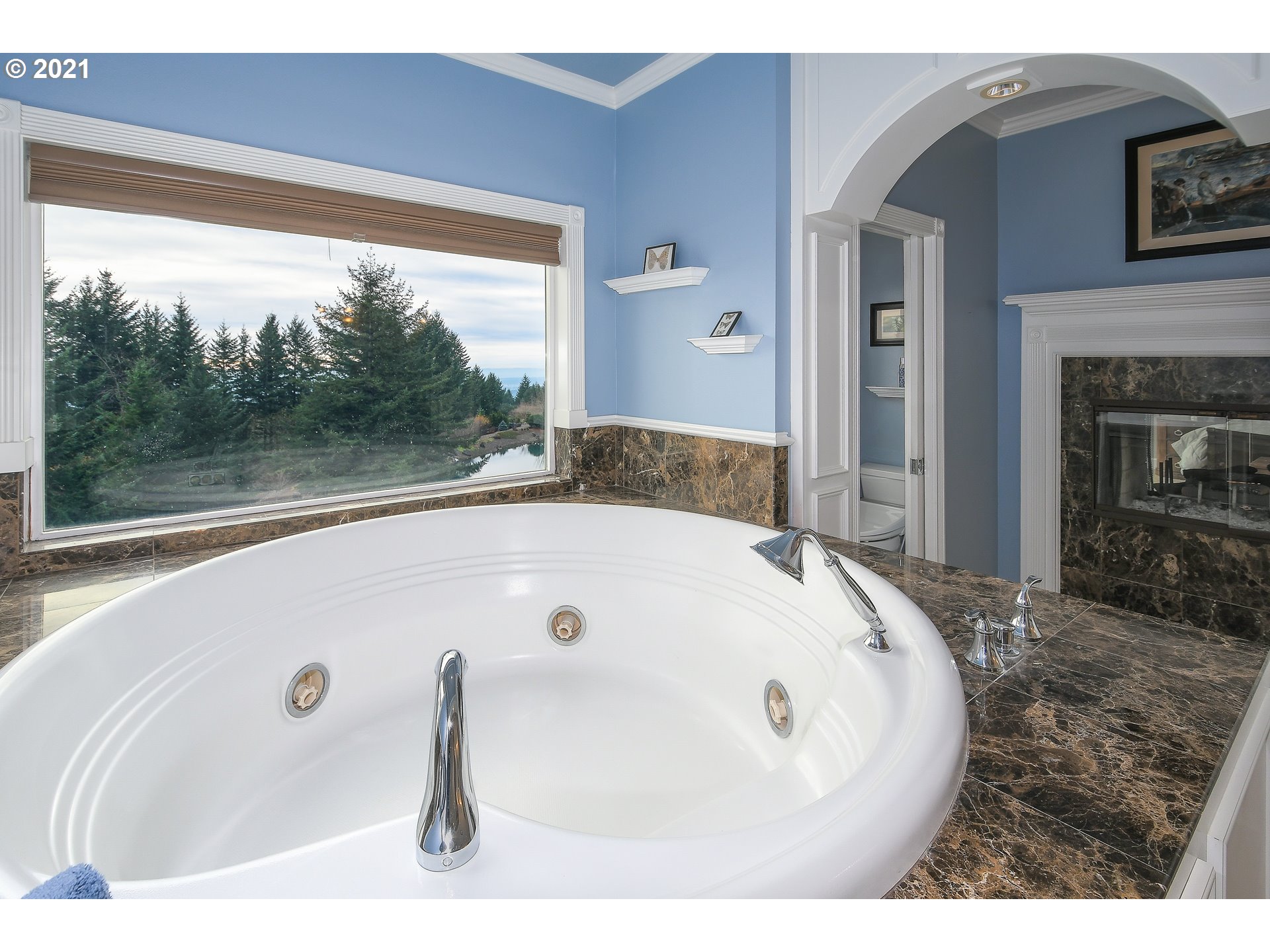 28400 Northeast Hancock Road Camas, WA 98607 - Photo 19 of 32 a bathroom with a tub and a large window