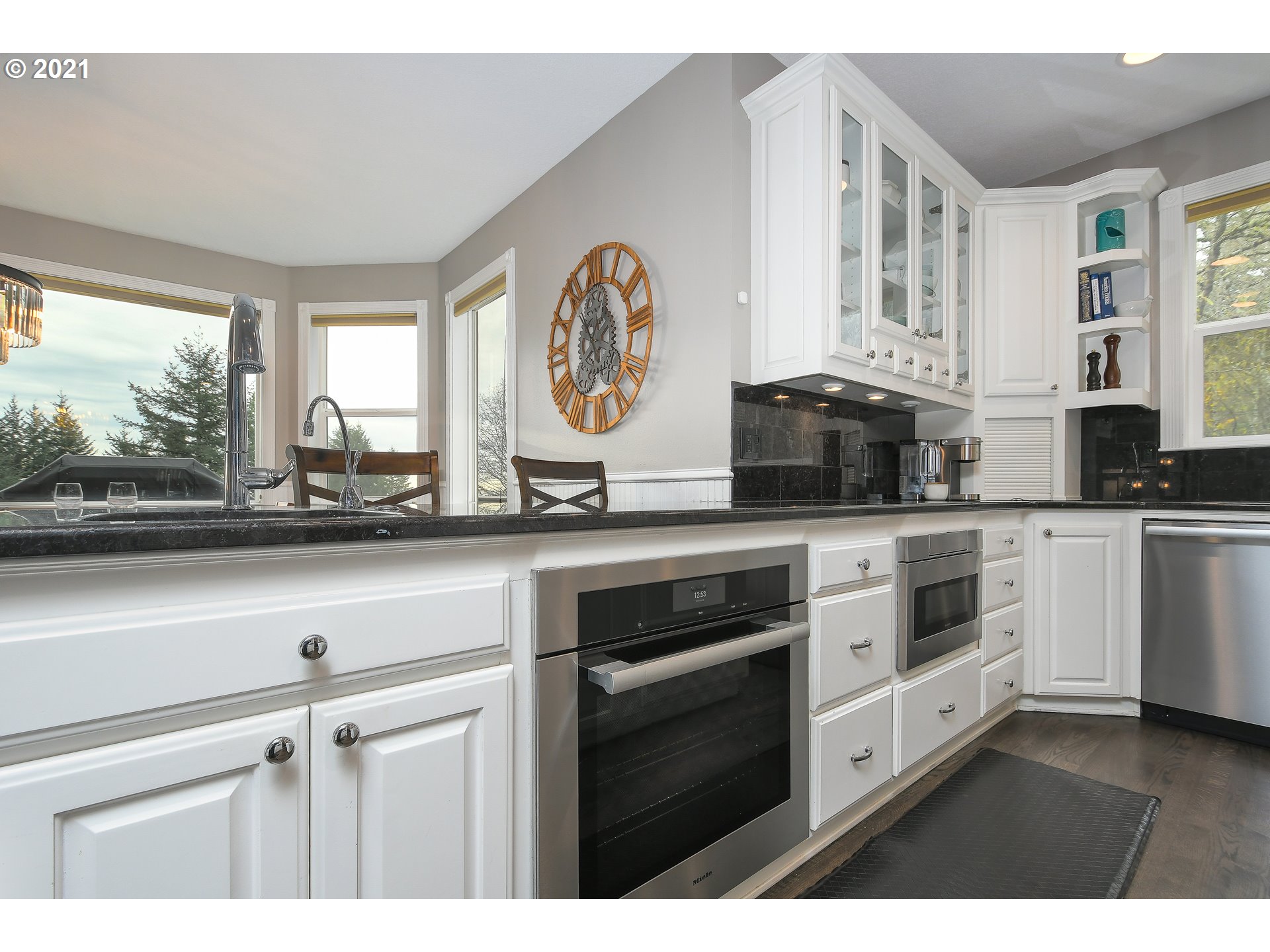 28400 Northeast Hancock Road Camas, WA 98607 - Photo 8 of 32 a kitchen with stainless steel appliances granite countertop a stove a sink and a microwave