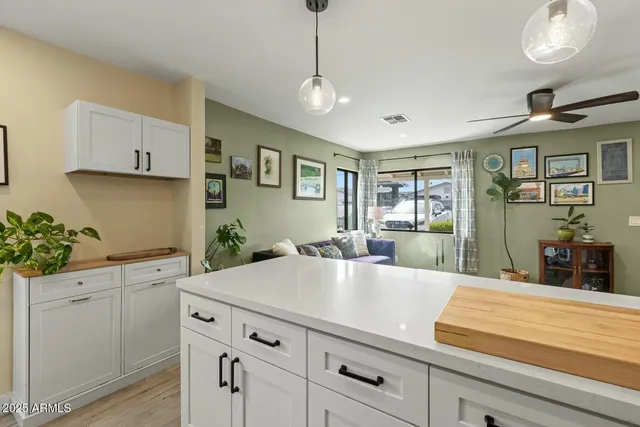 a kitchen with a sink and cabinets