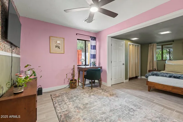 a view of a livingroom with furniture and a flat screen tv
