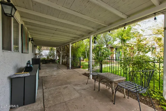 a backyard of a house with outdoor seating