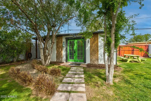a front view of a house with garden