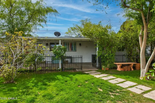 front view of a house with a yard