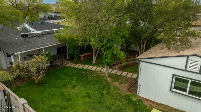 a aerial view of a house with a yard