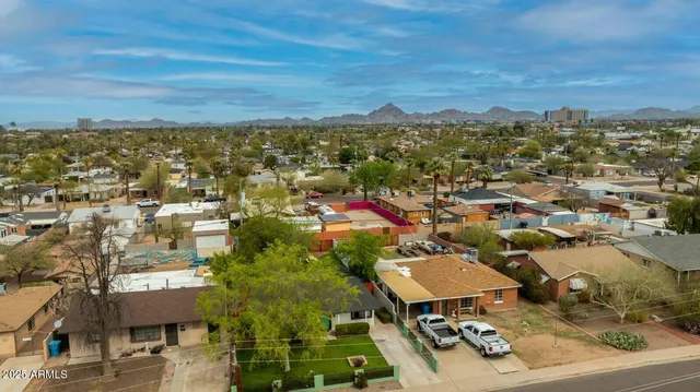 an aerial view of residential houses with outdoor space