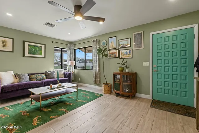 a living room with furniture and a window