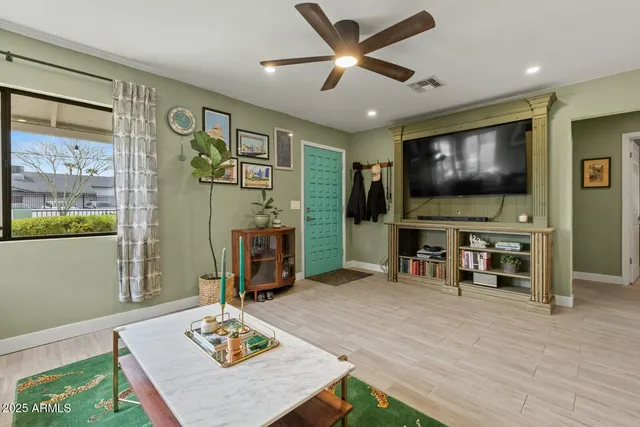 a living room with furniture and a flat screen tv