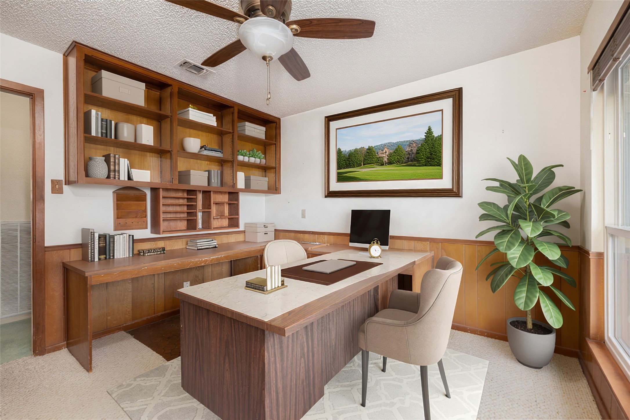 5319 Musket Ridge Austin, TX 78759 - Photo 25 of 39 A well-appointed office features extensive built-in shelving and ample natural light.