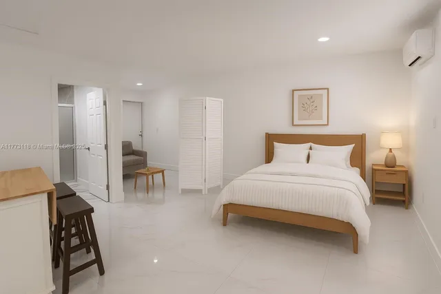 a bedroom with a bed and a chair