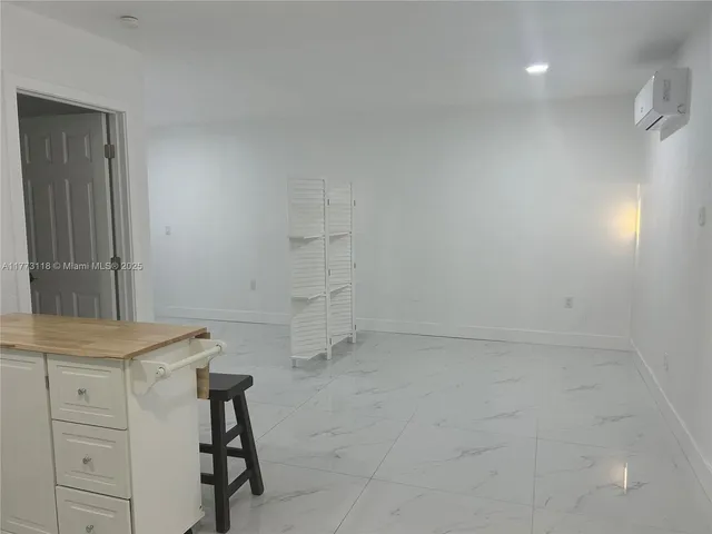 a kitchen with a stove a refrigerator and a sink