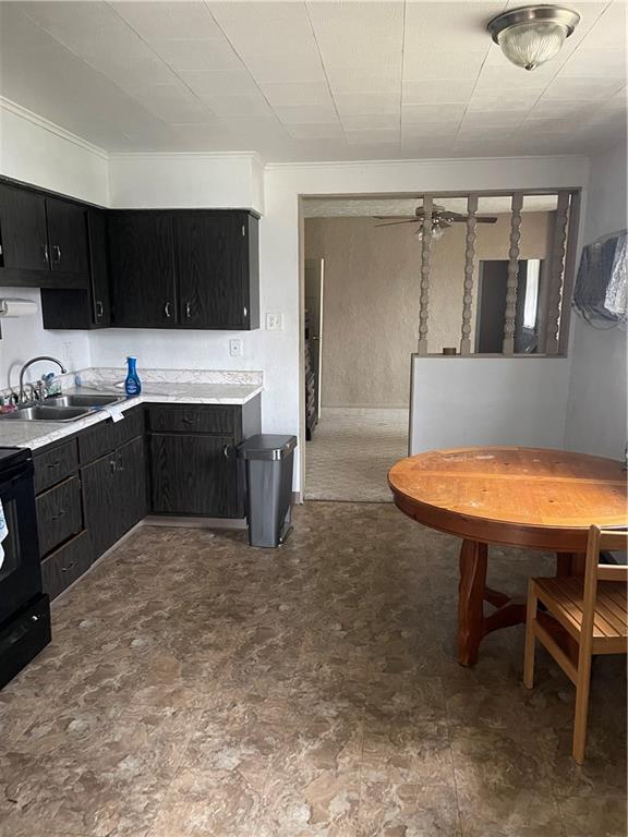 97 A & B United Rd Mount Mount Pleasant, PA 15666 - Photo 3 of 17 a kitchen with stainless steel appliances a sink and a refrigerator