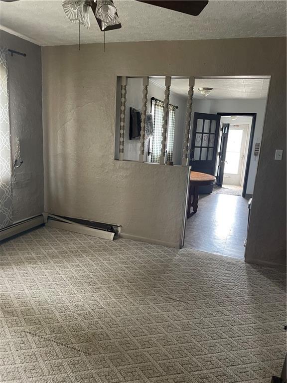 97 A & B United Rd Mount Mount Pleasant, PA 15666 - Photo 4 of 17 a view of an empty room with wooden floor and a window