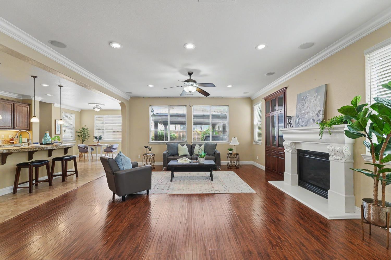 1223 East Springer Drive Turlock, CA 95382 - Photo 9 of 48 a living room with furniture large window and wooden floor