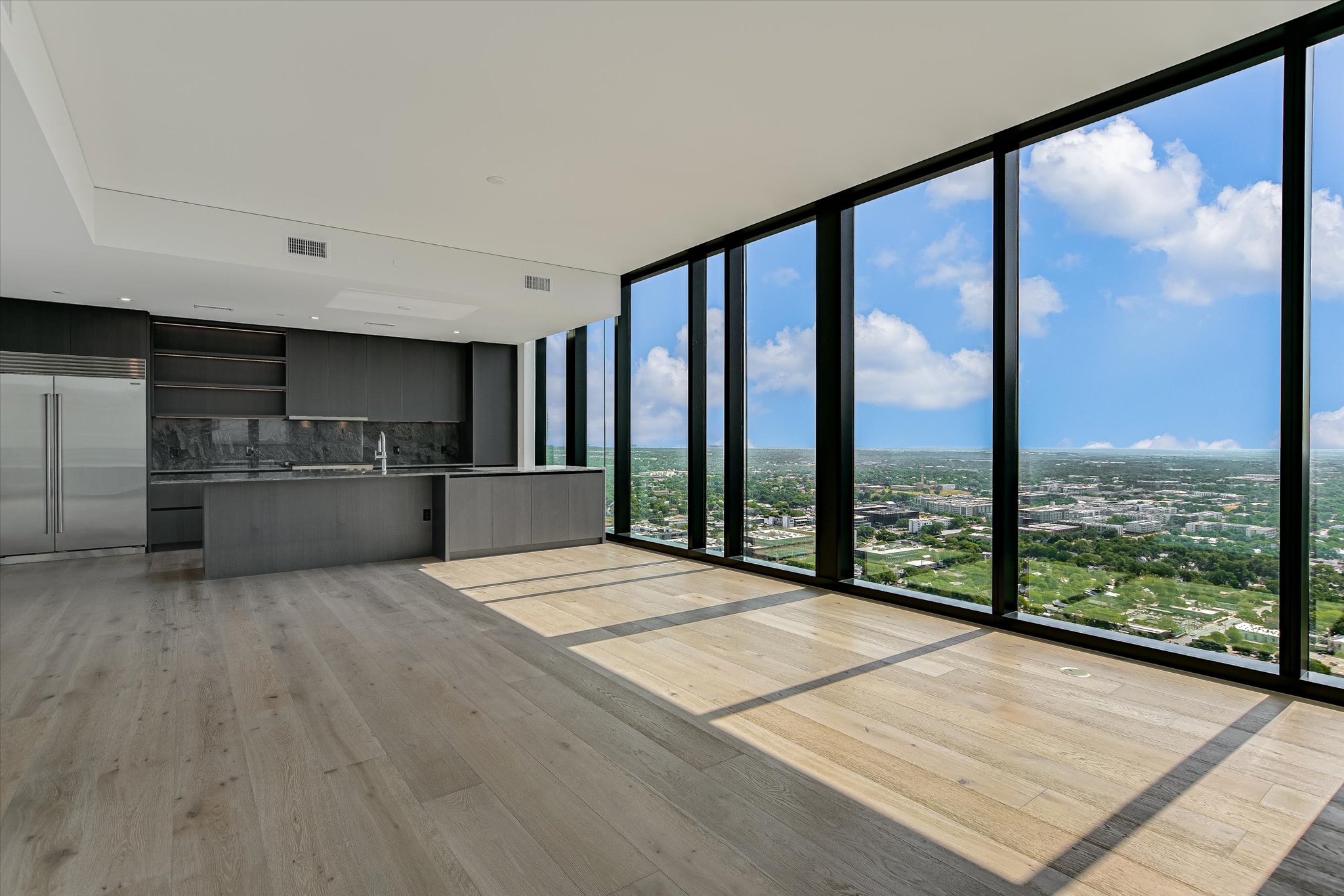 610 Davis Street, Unit 3801 Austin, TX 78701 - Photo 3 of 40 a open kitchen with a large window