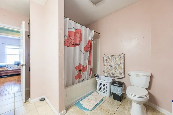 a white toilet sitting next to a bathroom sink