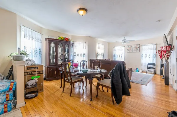 a view of a dining room with furniture and wooden floor