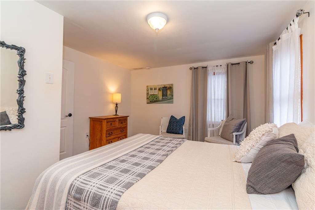 14 John Street Carnegie, PA 15106 - Photo 13 of 41 a bedroom with a large bed and a window