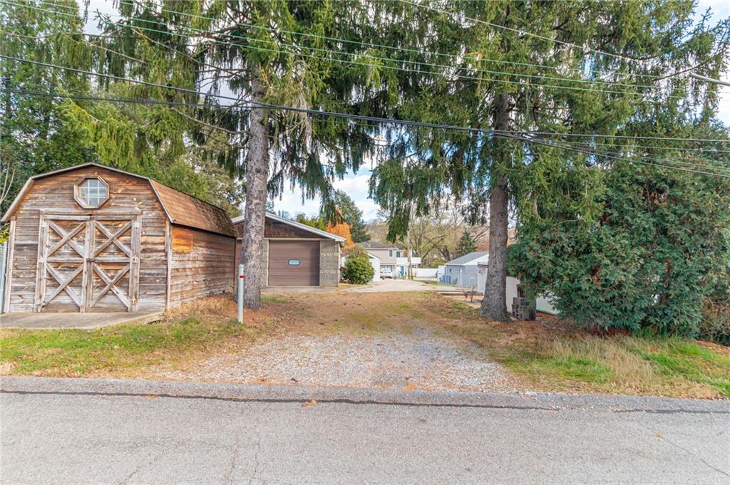 14 John Street Carnegie, PA 15106 - Photo 29 of 41 a view of a house with a yard and a large tree