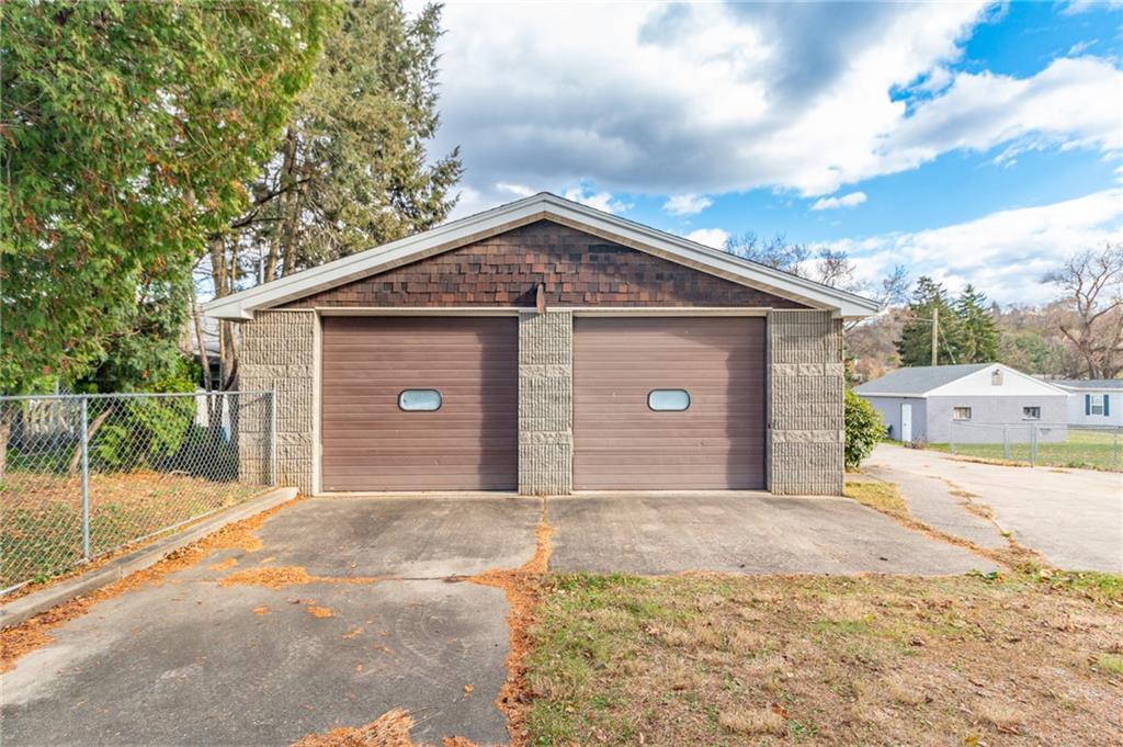 14 John Street Carnegie, PA 15106 - Photo 31 of 41 a front view of a house with a yard and garage