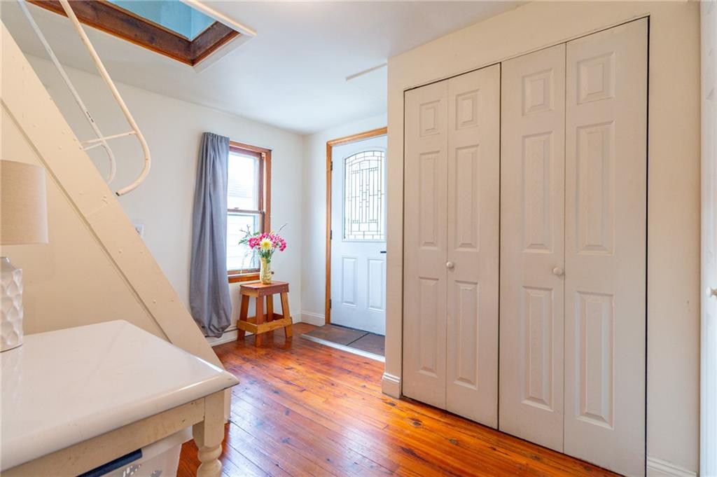 14 John Street Carnegie, PA 15106 - Photo 4 of 41 a view of a hallway with furniture and wooden floor