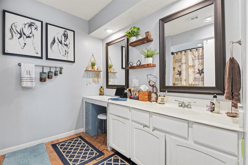 9446 Chimney Corner Dallas, TX 75243 - Photo 8 of 15 a bathroom with a sink and a window