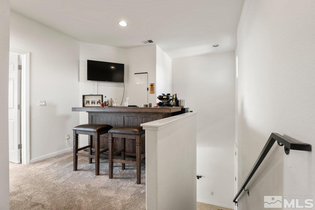 11022 Colton Drive Reno, NV 89521 - Photo 13 of 26 a dining room with furniture and a flat screen tv